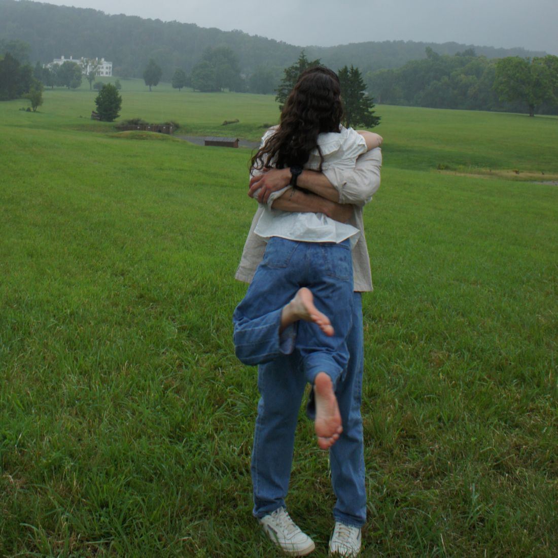 Melanie lifted off her feet in a hug